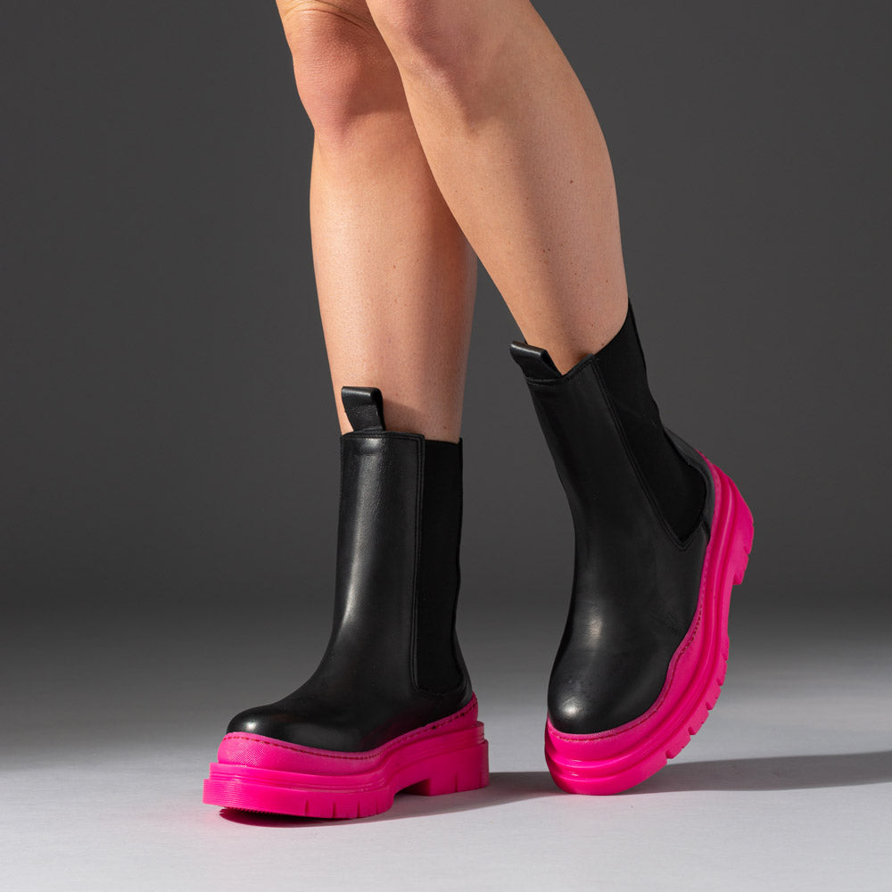 leather boots with hot pink chunky rubber soles