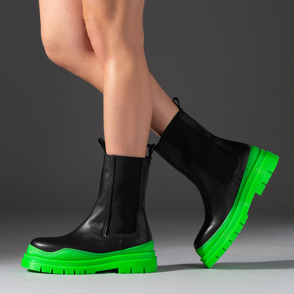 leather boots with neon green chunky rubber soles