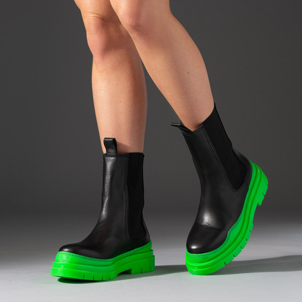 leather boots with neon green chunky rubber soles
